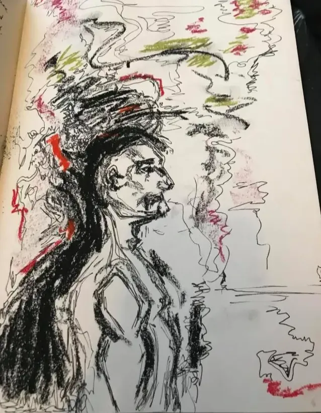 Expressive charcoal and coloured drawing of a figure on paper